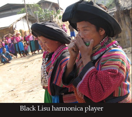 Black Lisu harmonica player